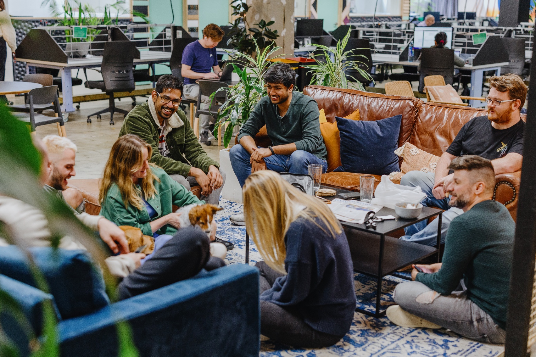 Members relaxing and connecting in a coworking community lounge